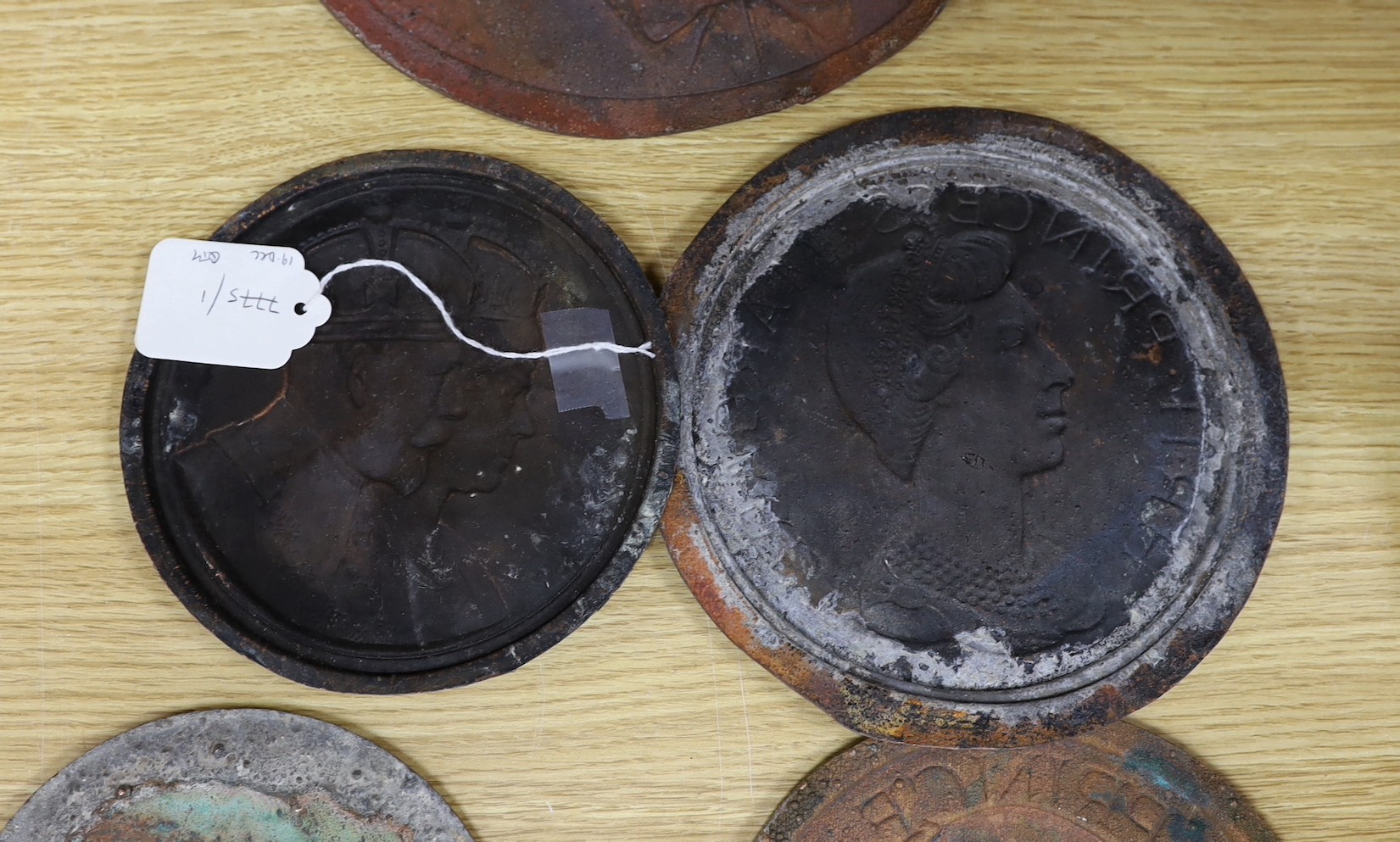 A group of six various cast copper or bronze medallion roundels. Largest 28cm diameter